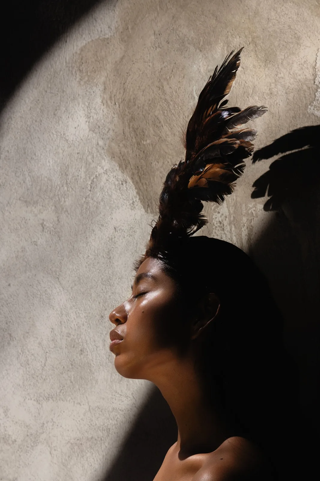 Profile with feather headpiece